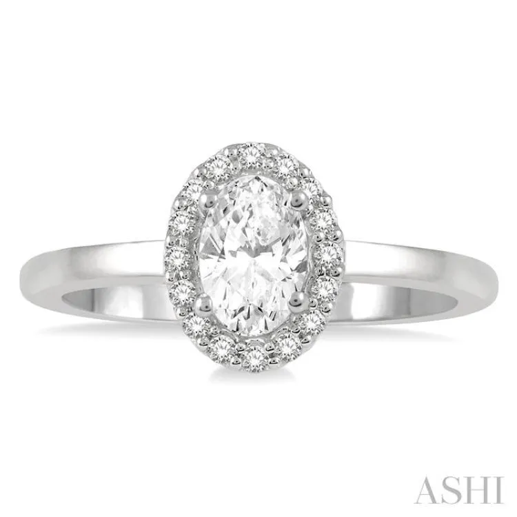 1/3 ctw Round Cut Diamond Halo Engagement Ring With 1/4 ctw Oval Cut Center Stone in 14K White Gold