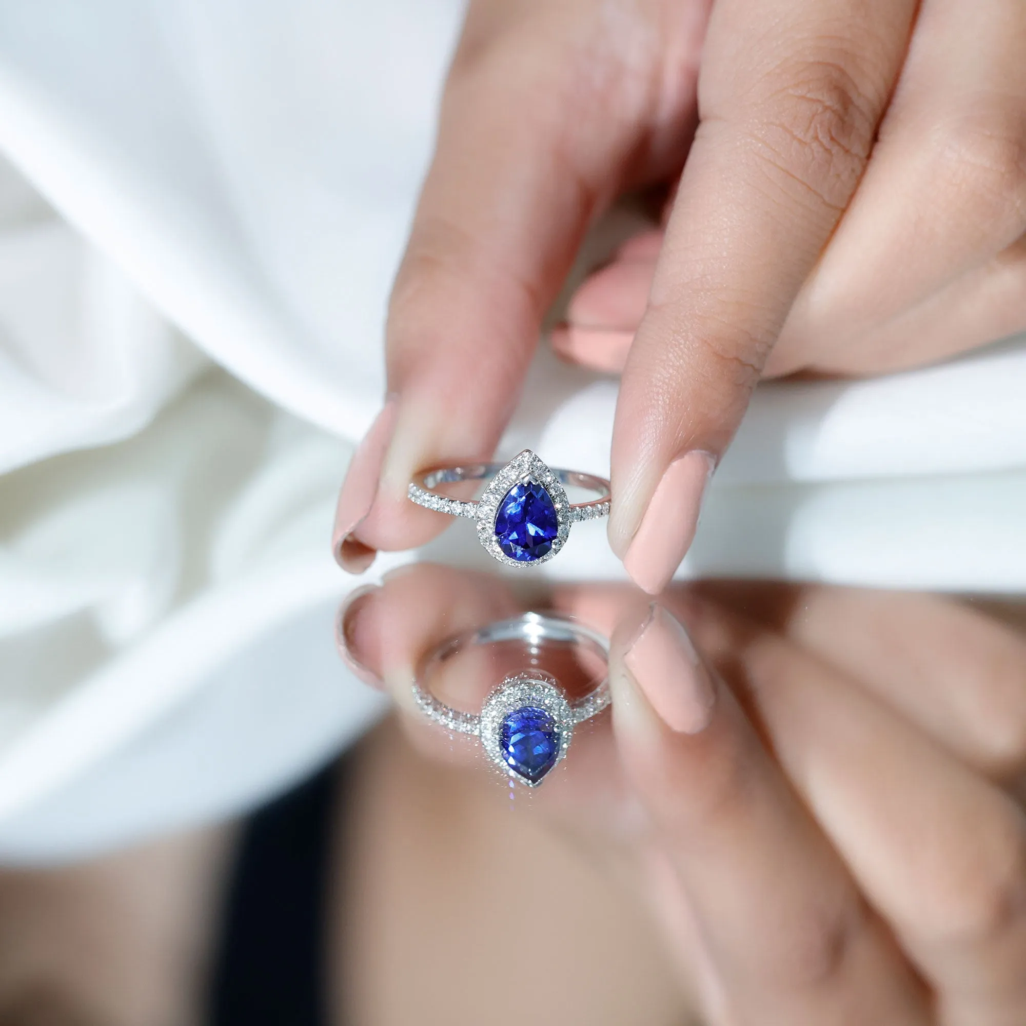 2 CT Created Blue Sapphire Teardrop Ring with Diamond Halo