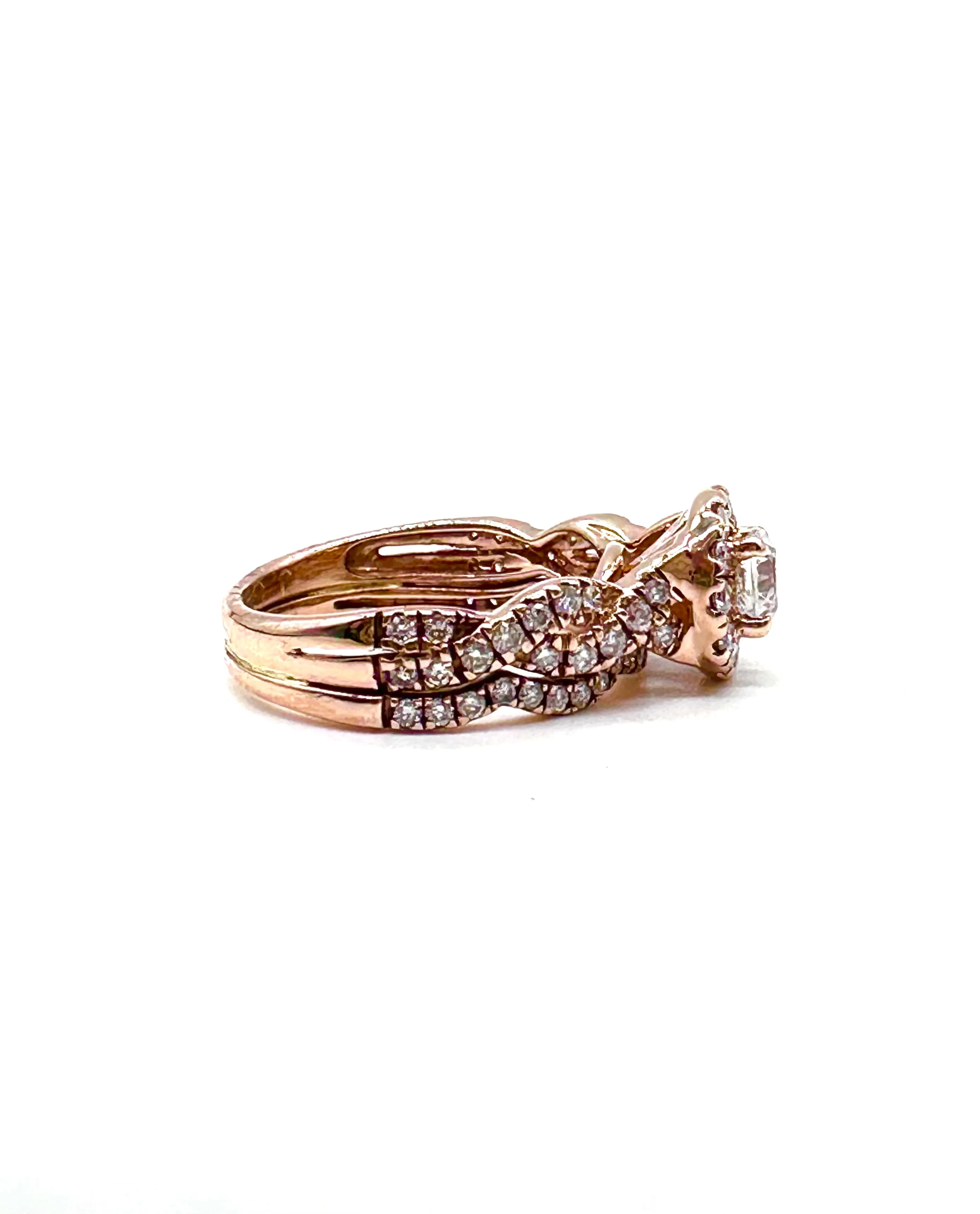 Diamond halo rose gold twist ring