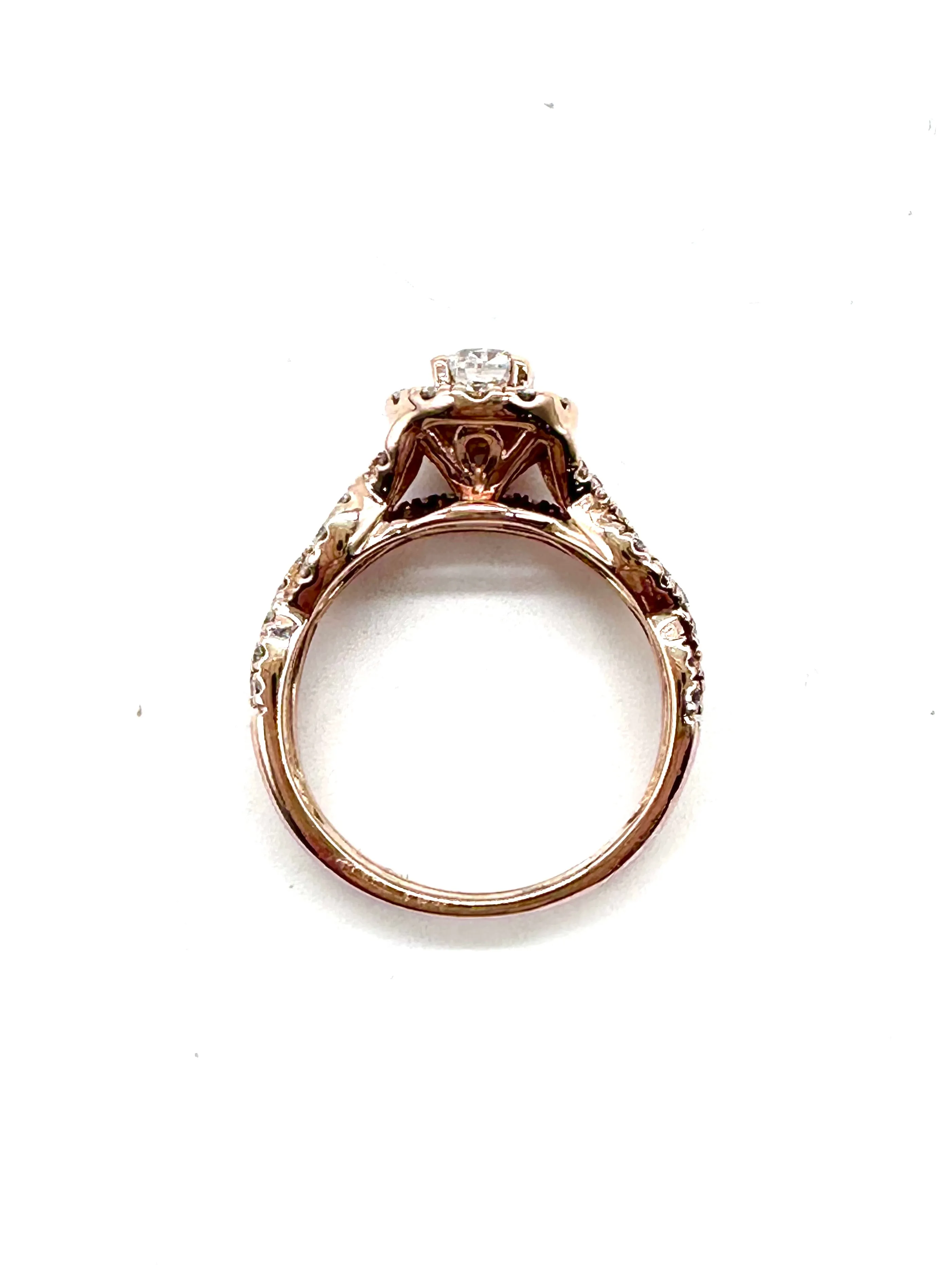 Diamond halo rose gold twist ring