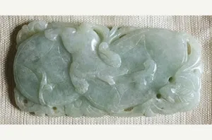 Light green Jade pendant with dog image