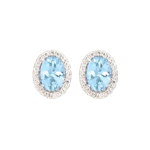 Oval Aquamarine And Diamond Halo Stud Earrings in 18k White Gold